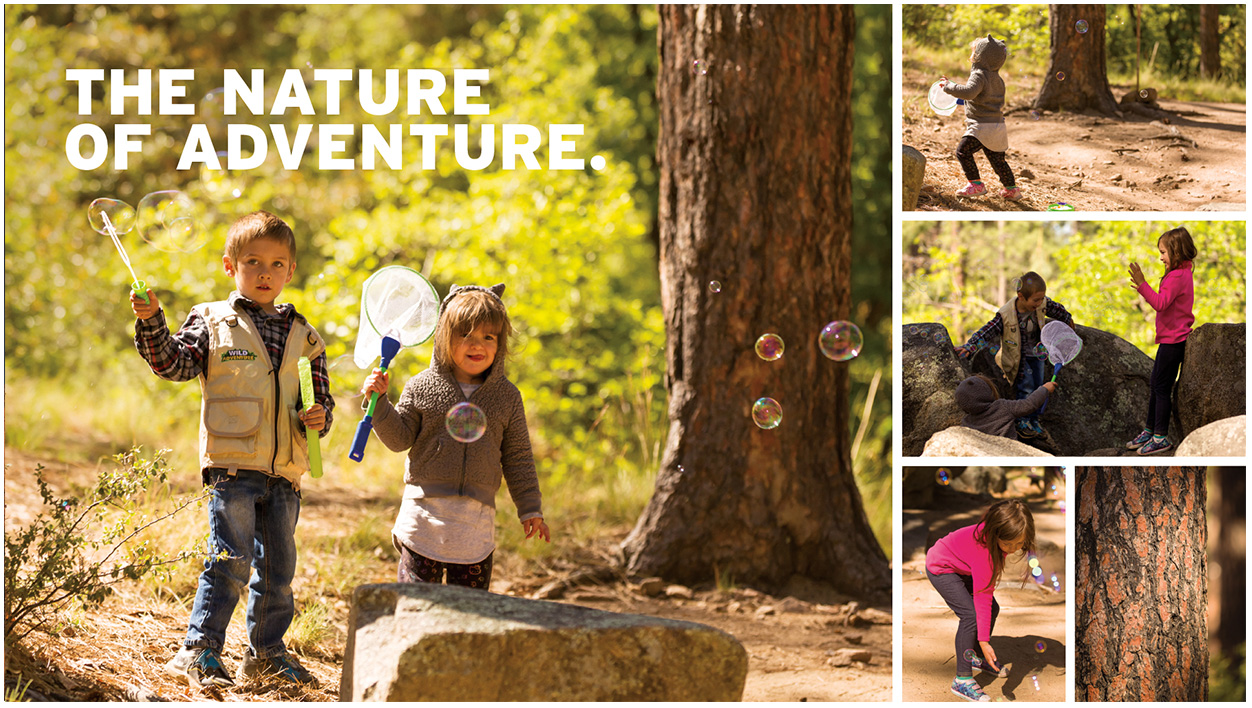 Children in the forest catching bubbles