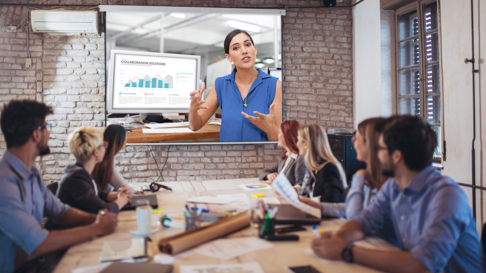 Business professional attending a training via video conference